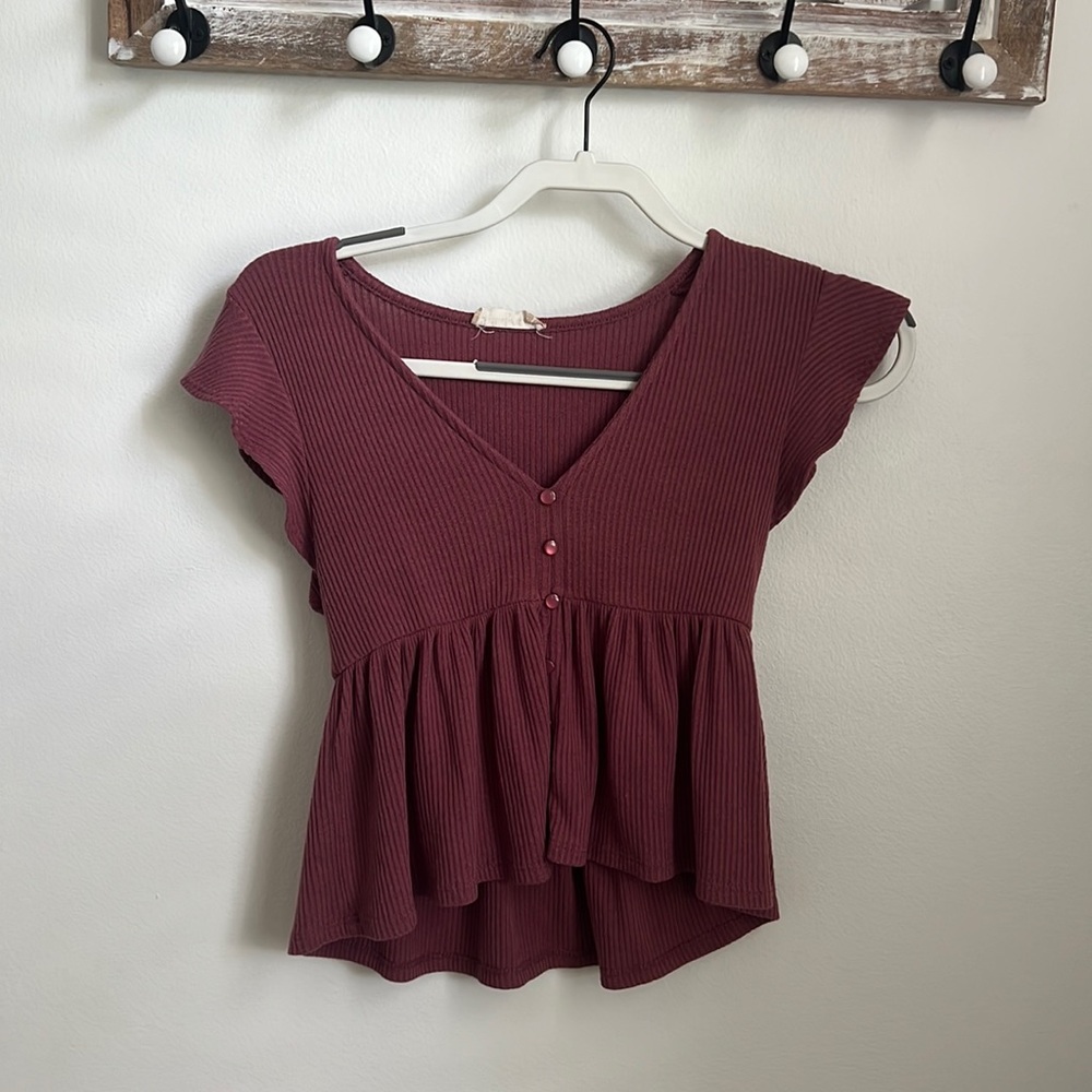 This is an altard state extra small burgundy top that has been barley worn.